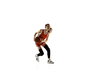 Image showing Young caucasian female basketball player against white studio background