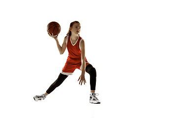 Image showing Young caucasian female basketball player against white studio background