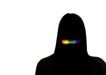 Image showing Dramatic portrait of a girl in the dark on white studio background with rainbow colored line