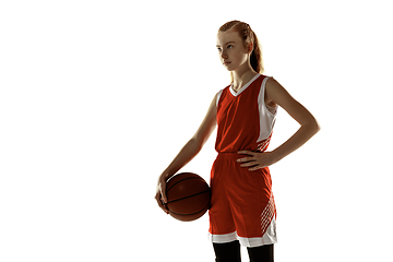 Image showing Young caucasian female basketball player against white studio background