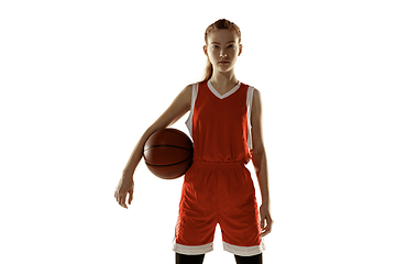 Image showing Young caucasian female basketball player against white studio background