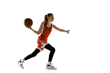 Image showing Young caucasian female basketball player against white studio background