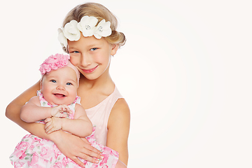 Image showing happy beautiful girl with baby baby sister