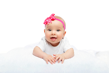Image showing happy beautiful baby girl with pink flower on head