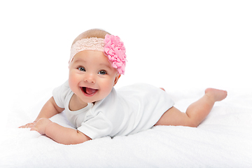 Image showing happy beautiful baby girl in white body suit