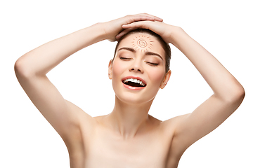 Image showing girl with sun drawing on forehead isolated on white