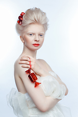 Image showing beautiful albino young woman with red lips