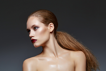 Image showing beautiful girl with long ponytail and red lips