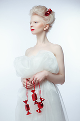 Image showing beautiful albino young woman with red lips