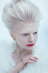 Image showing beautiful albino young woman with red lips