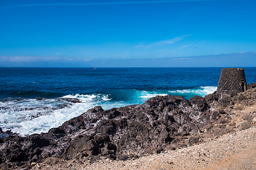 Image showing beautiful view on ocean water and black lava sand