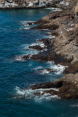 Image showing beautiful view on ocean water and black lava sand