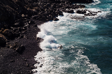 Image showing beautiful view on ocean water and black lava sand