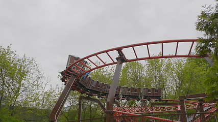 Image showing MOSCOW, RUSSIA, May 21, 2017: Children go in roller coaster and having fun on a cloudy day, Moscow.