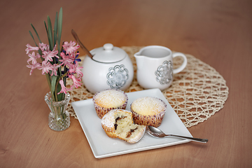 Image showing fresh homemade Muffin at wooden table