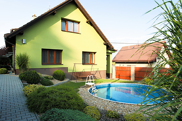 Image showing beautiful green colored rural house