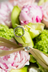 Image showing wedding ring and beautiful flowers.