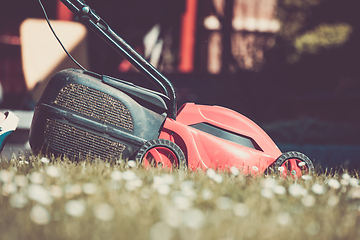 Image showing lawnmower on green grass