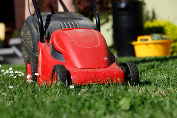 Image showing lawnmower on green grass