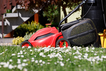 Image showing lawnmower on green grass