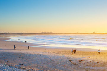 Image showing People  surfers walking beach ocean