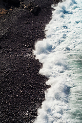 Image showing beautiful view on ocean water and black lava sand