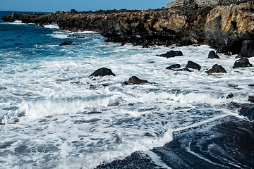 Image showing beautiful view on ocean water and black lava sand