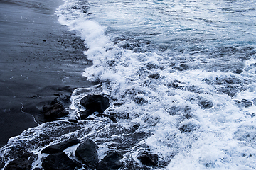 Image showing beautiful view on ocean water and black lava sand