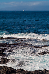 Image showing beautiful view on ocean water and black lava sand