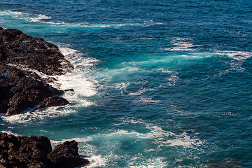 Image showing beautiful view on ocean water and black lava sand