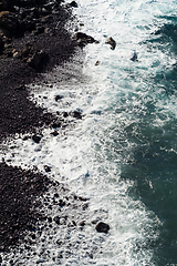 Image showing beautiful view on ocean water and black lava sand