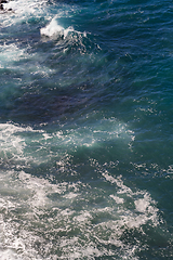 Image showing beautiful view on ocean water and black lava sand