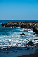 Image showing beautiful view on ocean water and black lava sand