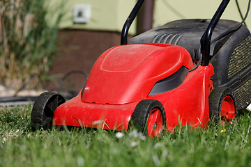 Image showing lawnmower on green grass