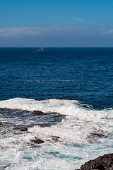 Image showing beautiful view on ocean water and black lava sand