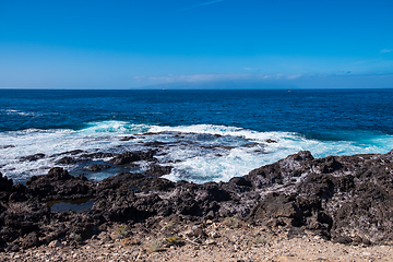 Image showing beautiful view on ocean water and black lava sand