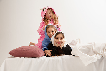 Image showing Children in soft warm pajamas having party colored bright playing at home