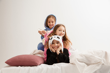 Image showing Children in soft warm pajamas having party colored bright playing at home