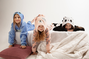 Image showing Children in soft warm pajamas having party colored bright playing at home