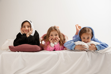 Image showing Children in soft warm pajamas having party colored bright playing at home