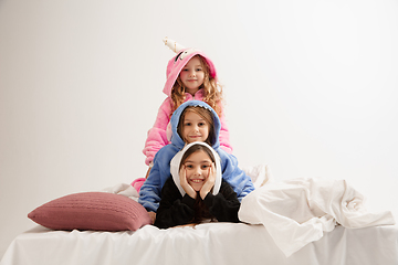 Image showing Children in soft warm pajamas having party colored bright playing at home