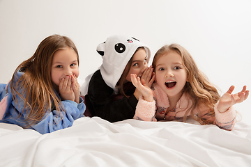 Image showing Children in soft warm pajamas having party colored bright playing at home