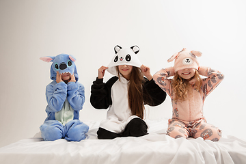 Image showing Children in soft warm pajamas having party colored bright playing at home