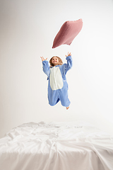 Image showing Little girl in soft warm pajama having party colored bright playing at home