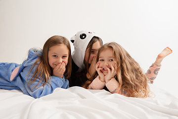 Image showing Children in soft warm pajamas having party colored bright playing at home