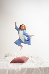 Image showing Little girl in soft warm pajama having party colored bright playing at home