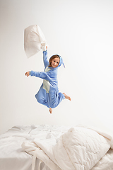 Image showing Little girl in soft warm pajama having party colored bright playing at home