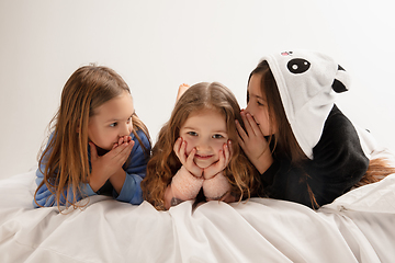 Image showing Children in soft warm pajamas having party colored bright playing at home