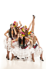 Image showing Beautiful young women in carnival and masquerade costumes on white studio background