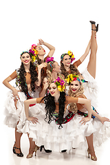 Image showing Beautiful young women in carnival and masquerade costumes on white studio background